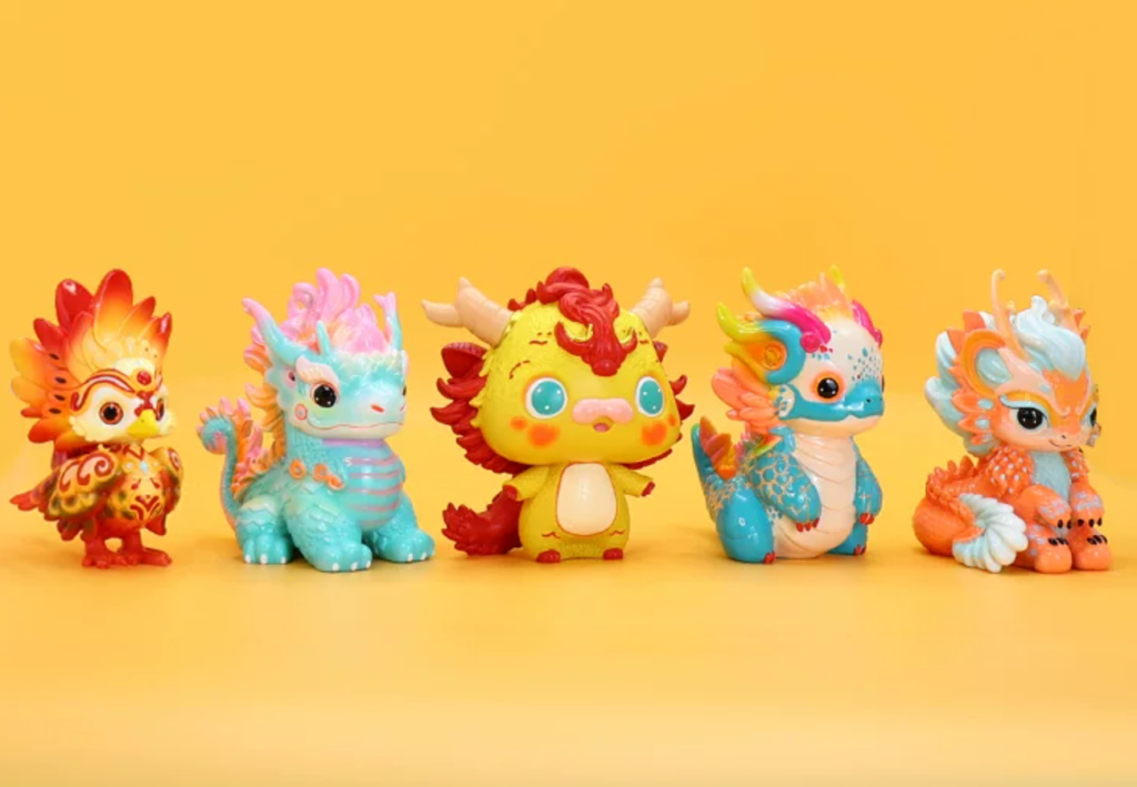 Five colorful dragon collectible figures displayed against a yellow background