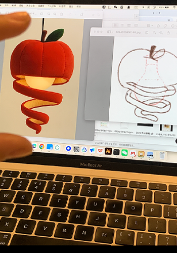 Red apple plush lamp prototype compared with the design drawing