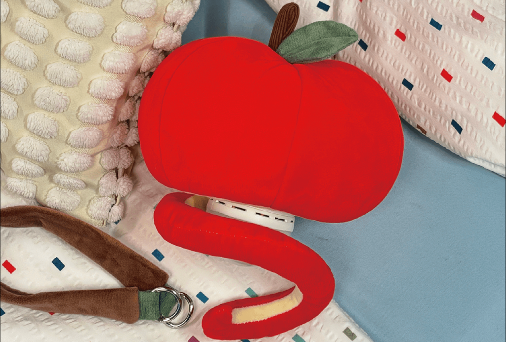Red apple plush pendant lamp showing the LED control module beneath the plush shell
